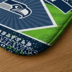 customized-seattle-seahawks-football-crest-blue-black-doormat-best-selling.webp