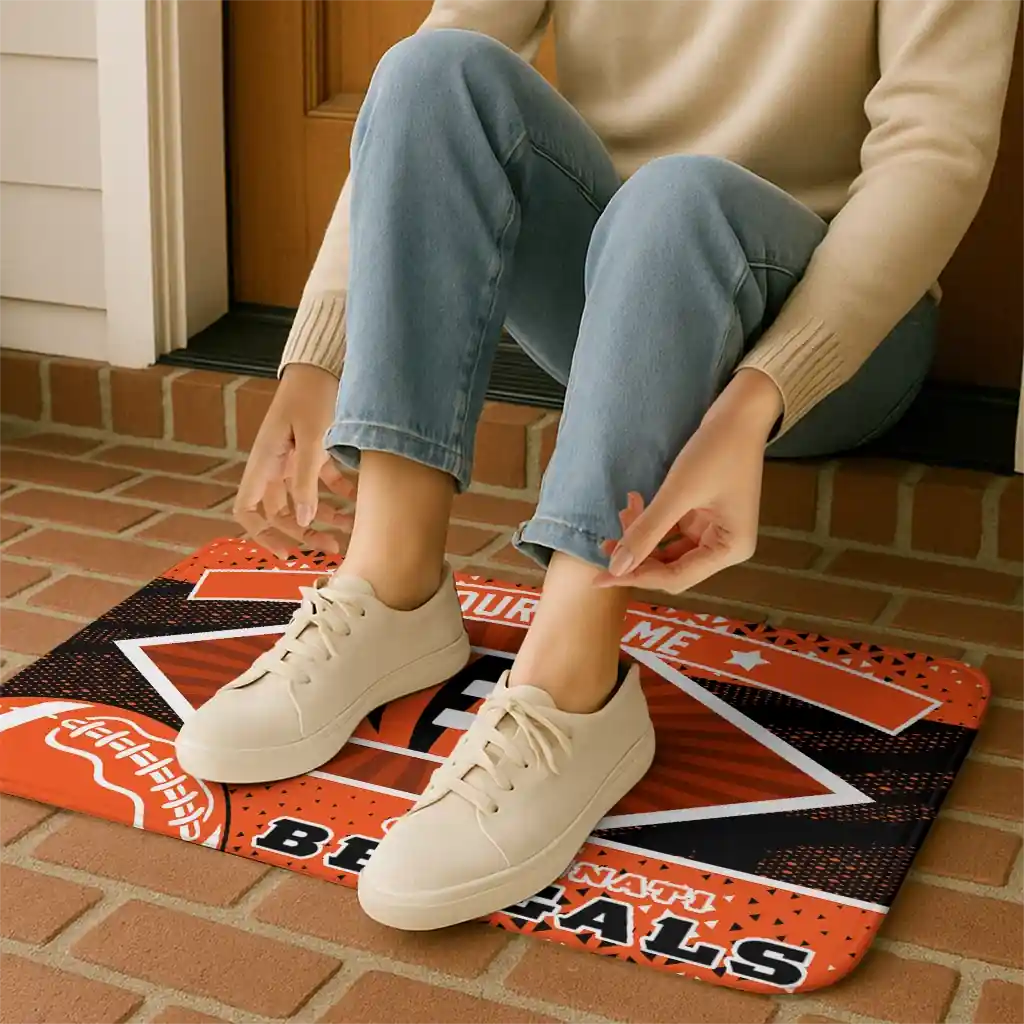 personalized-cincinnati-bengals-football-crest-orange-black-doormat-top-rated.webp