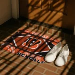 personalized-cincinnati-bengals-football-crest-orange-black-doormat-best-selling.webp