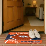 personalized-denver-broncos-football-crest-orange-black-doormat-best-selling.webp