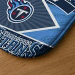 personalized-tennessee-titans-football-crest-navy-black-doormat-best-selling.webp