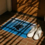 carolina-panthers-pixel-blur-blue-doormat-best-selling.webp