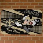 custom-new-orleans-saints-mickey-quarterback-gold-black-doormat-best-selling.webp
