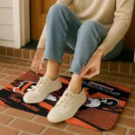 customized-cincinnati-bengals-mickey-quarterback-orange-black-doormat-best-selling.webp