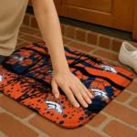 denver-broncos-palm-silhouette-orange-black-doormat-best-selling.webp