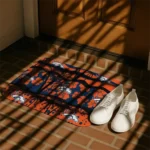 denver-broncos-palm-silhouette-orange-black-doormat-best-selling.webp