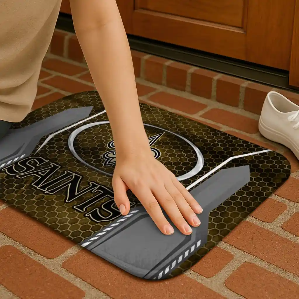 new-orleans-saints-hexagon-oval-gold-doormat-premium-grade.webp