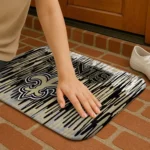 new-orleans-saints-vertical-flow-gold-doormat-best-selling.webp