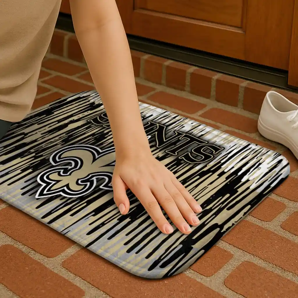 new-orleans-saints-vertical-flow-gold-doormat-premium-grade.webp