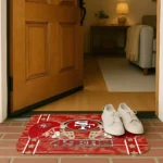 san-francisco-49ers-helmet-illustration-red-doormat-best-selling.webp