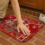 san-francisco-49ers-helmet-illustration-red-doormat-best-selling.webp